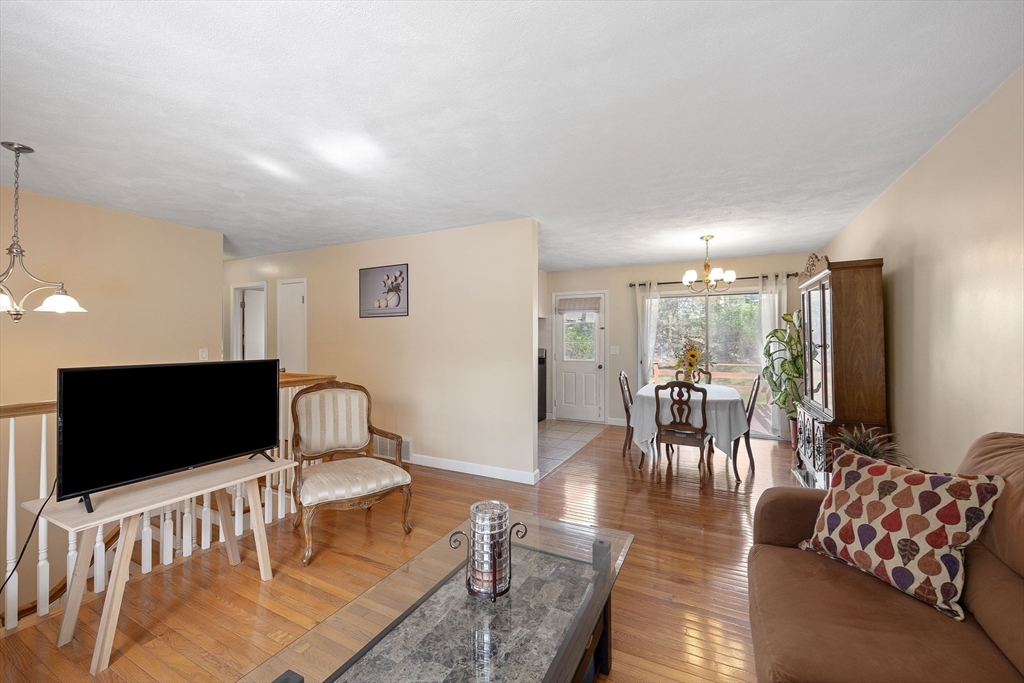 85 Tower Street Hudson, MA 01749 - Photo 8 of 25 a living room with furniture fireplace and a flat screen tv