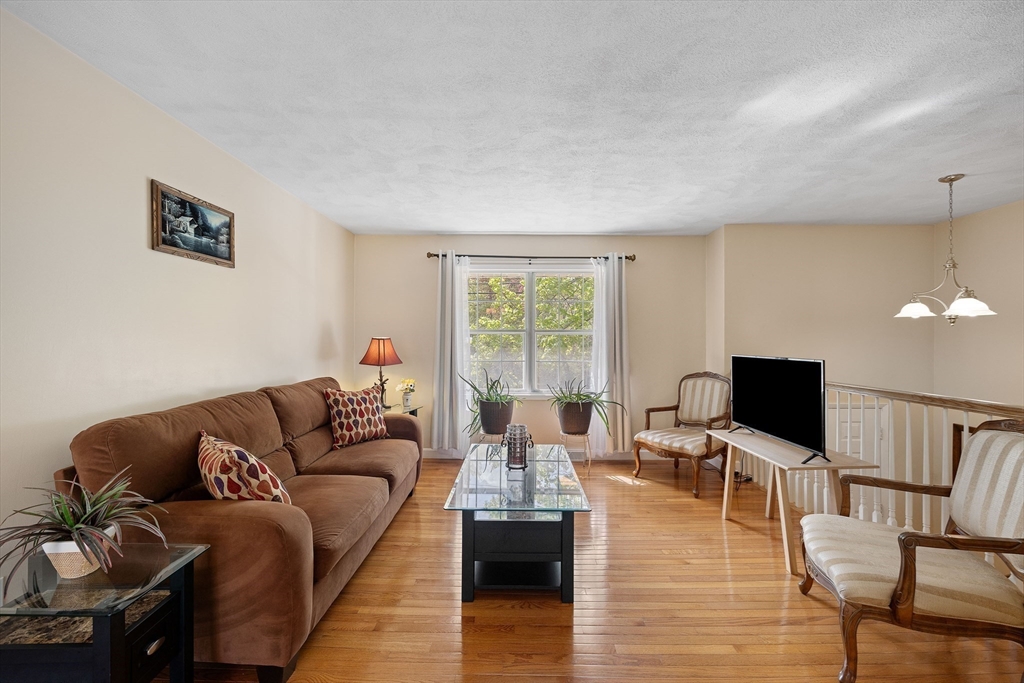 85 Tower Street Hudson, MA 01749 - Photo 9 of 25 a living room with furniture and a flat screen tv