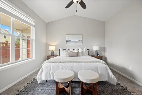 a bedroom with a bed and chandelier