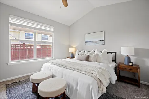 a bedroom with bed and a window