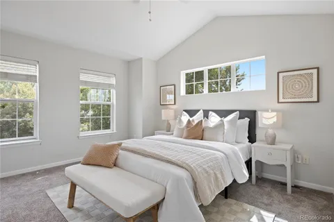 a bedroom with bed and a window