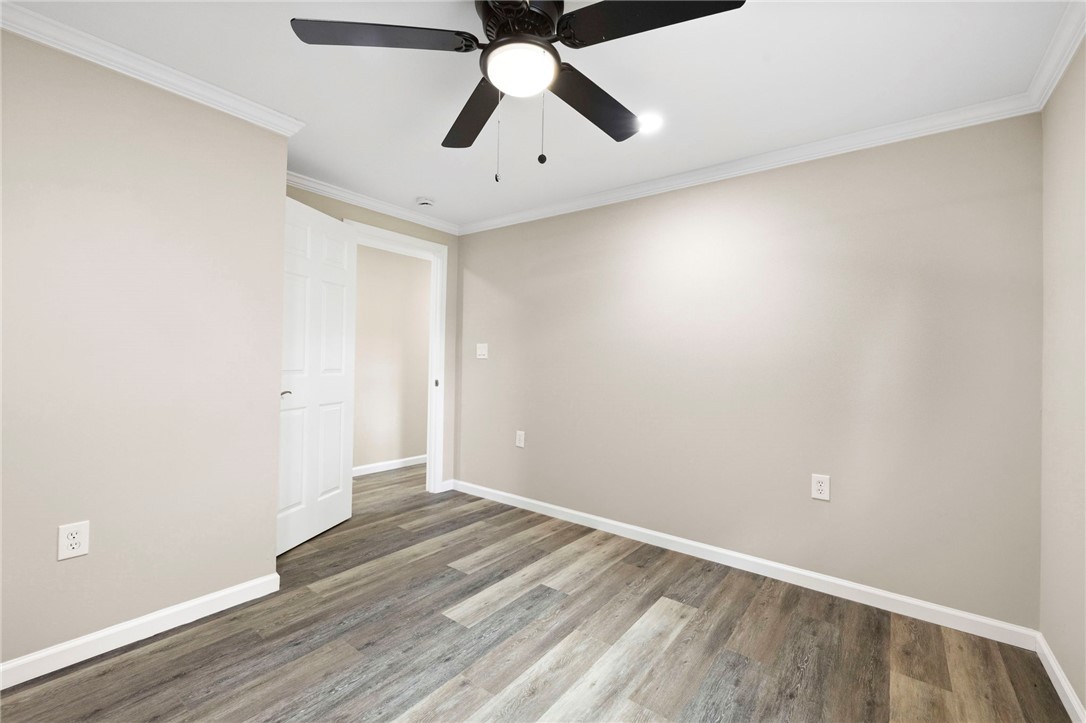 418 Old River Road Pelzer, SC 29669 - Photo 21 of 29 Stylish flooring and ceiling fan enhance the livability of this inviting space.