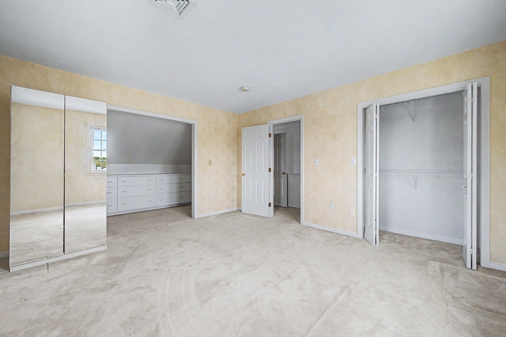 3 Oak View Terrace, Unit 3 Franklin, MA 02038 - Photo 22 of 38 an empty room with a cabinet and mirrors