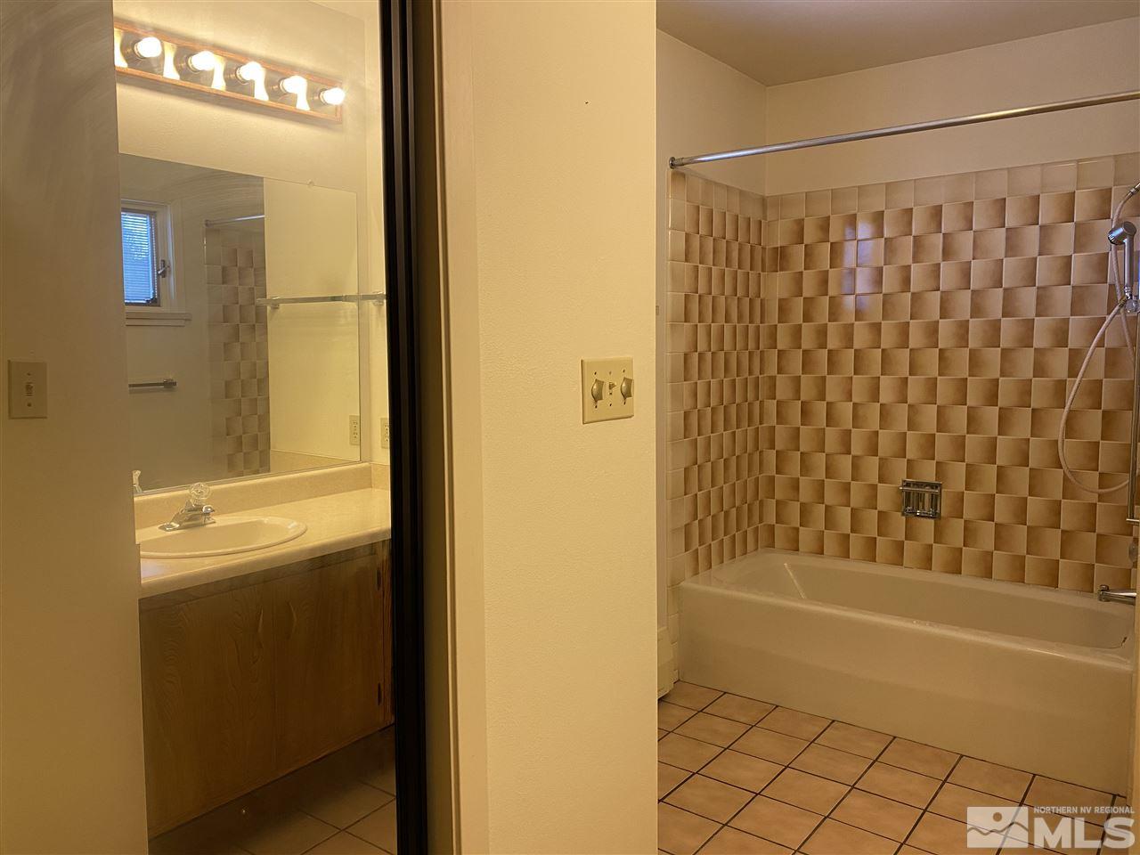 3900 Buckingham Square Reno, NV 89503 - Photo 23 of 35 a bathroom with a shower