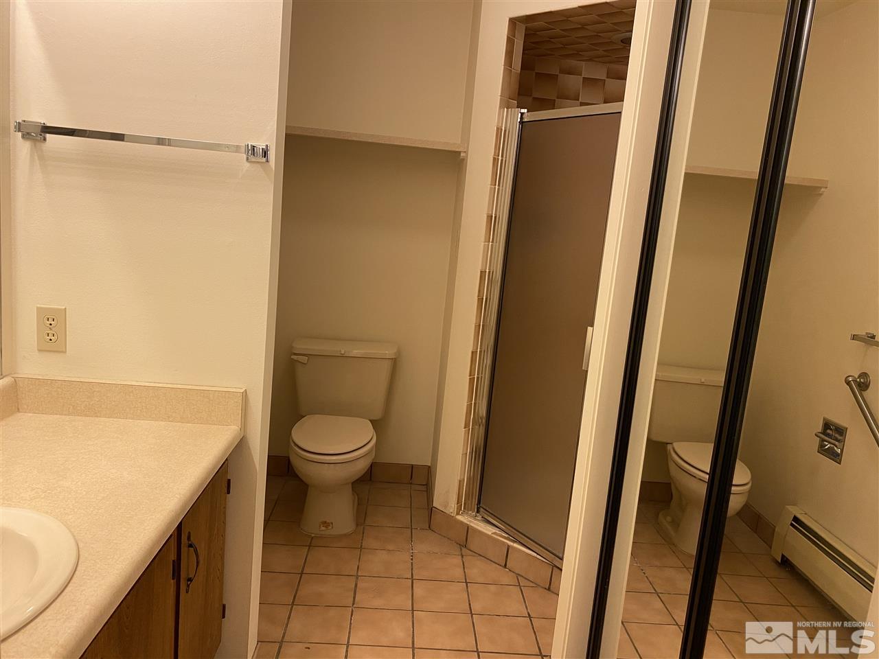 3900 Buckingham Square Reno, NV 89503 - Photo 24 of 35 a bathroom with a granite countertop sink toilet and shower