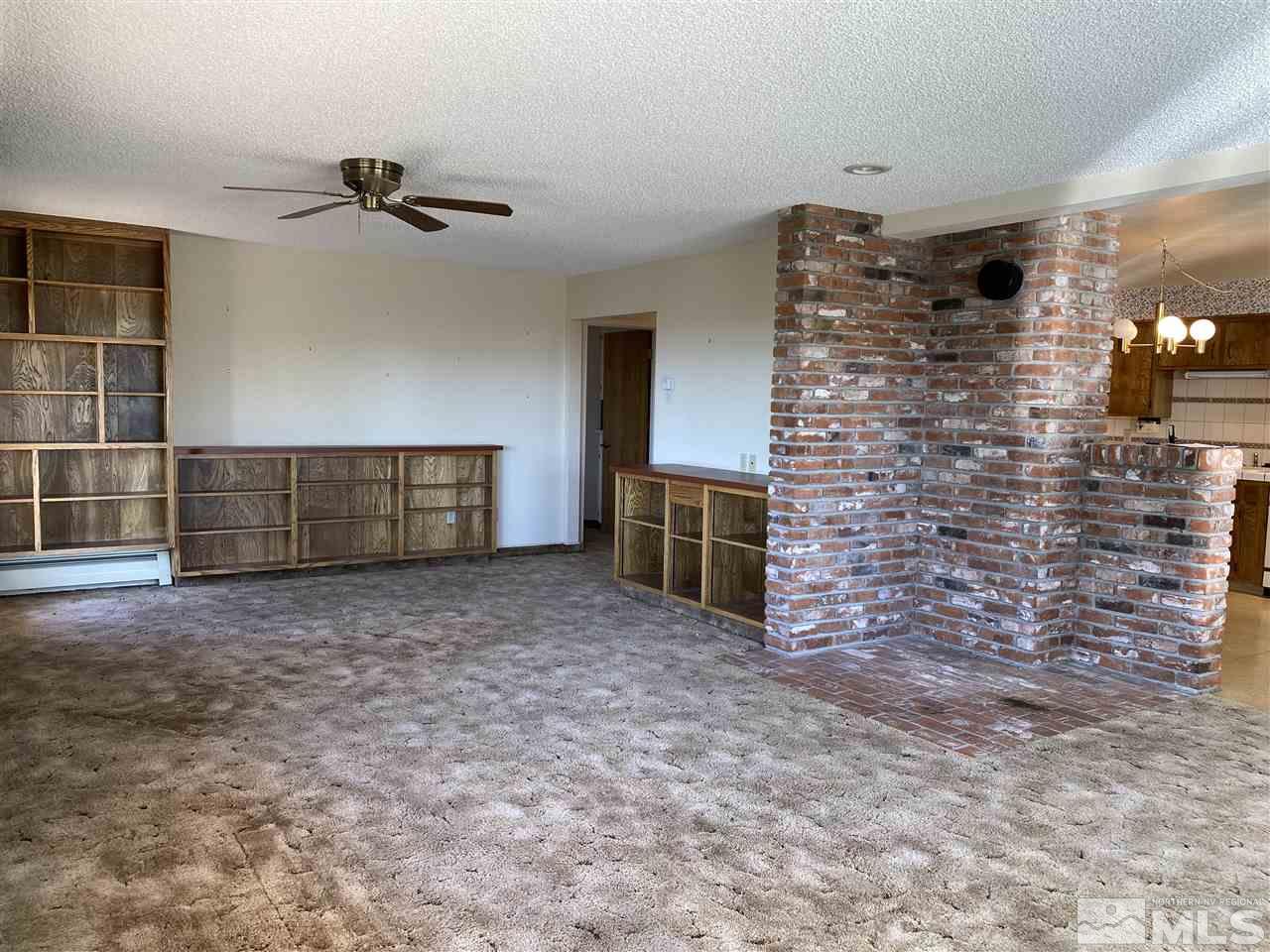 3900 Buckingham Square Reno, NV 89503 - Photo 5 of 35 a view of an empty room with a fireplace