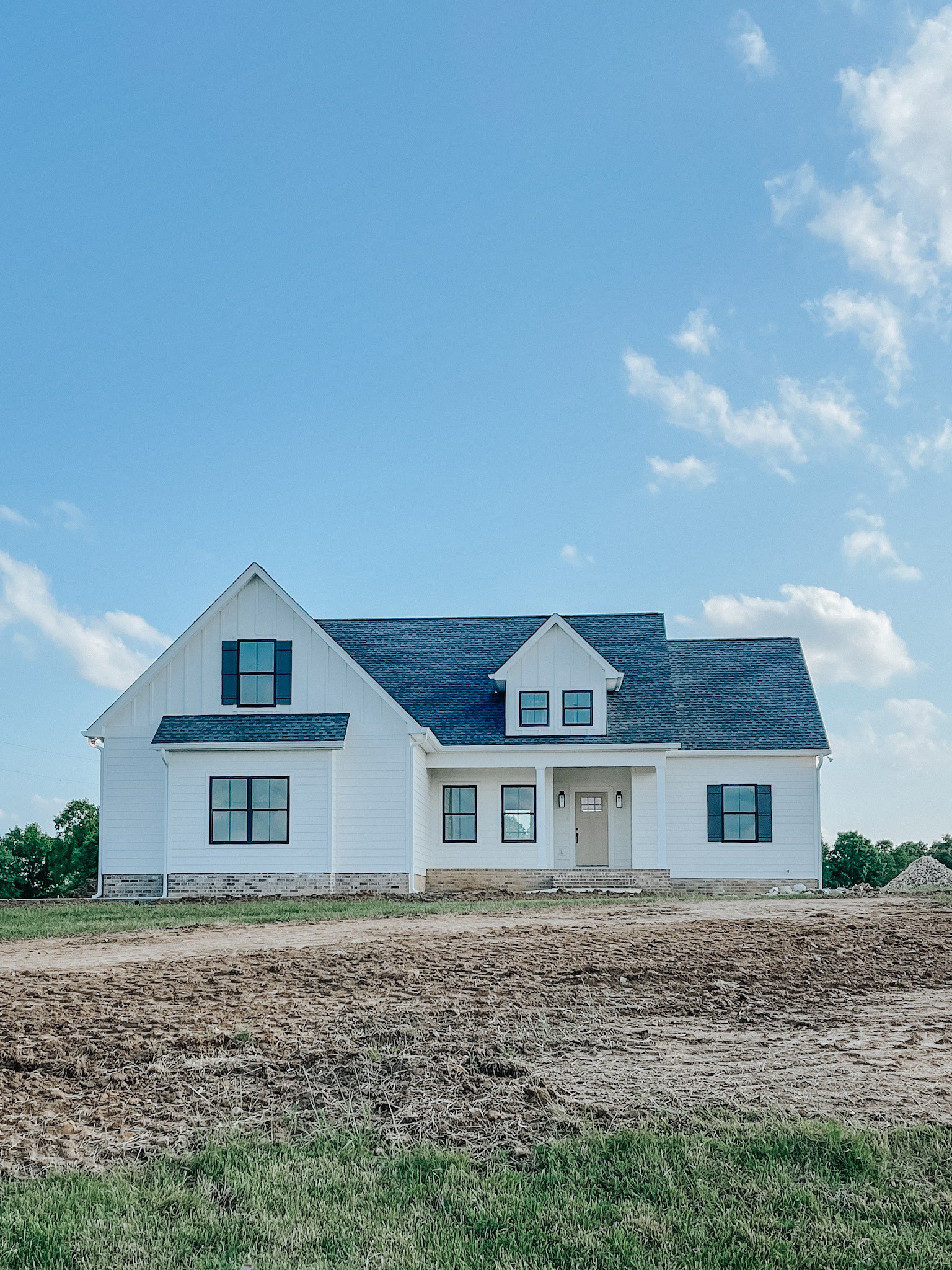 1402 Fowler Ford Road Portland, TN 37148 - Photo 1 of 27 a front view of a house with a yard