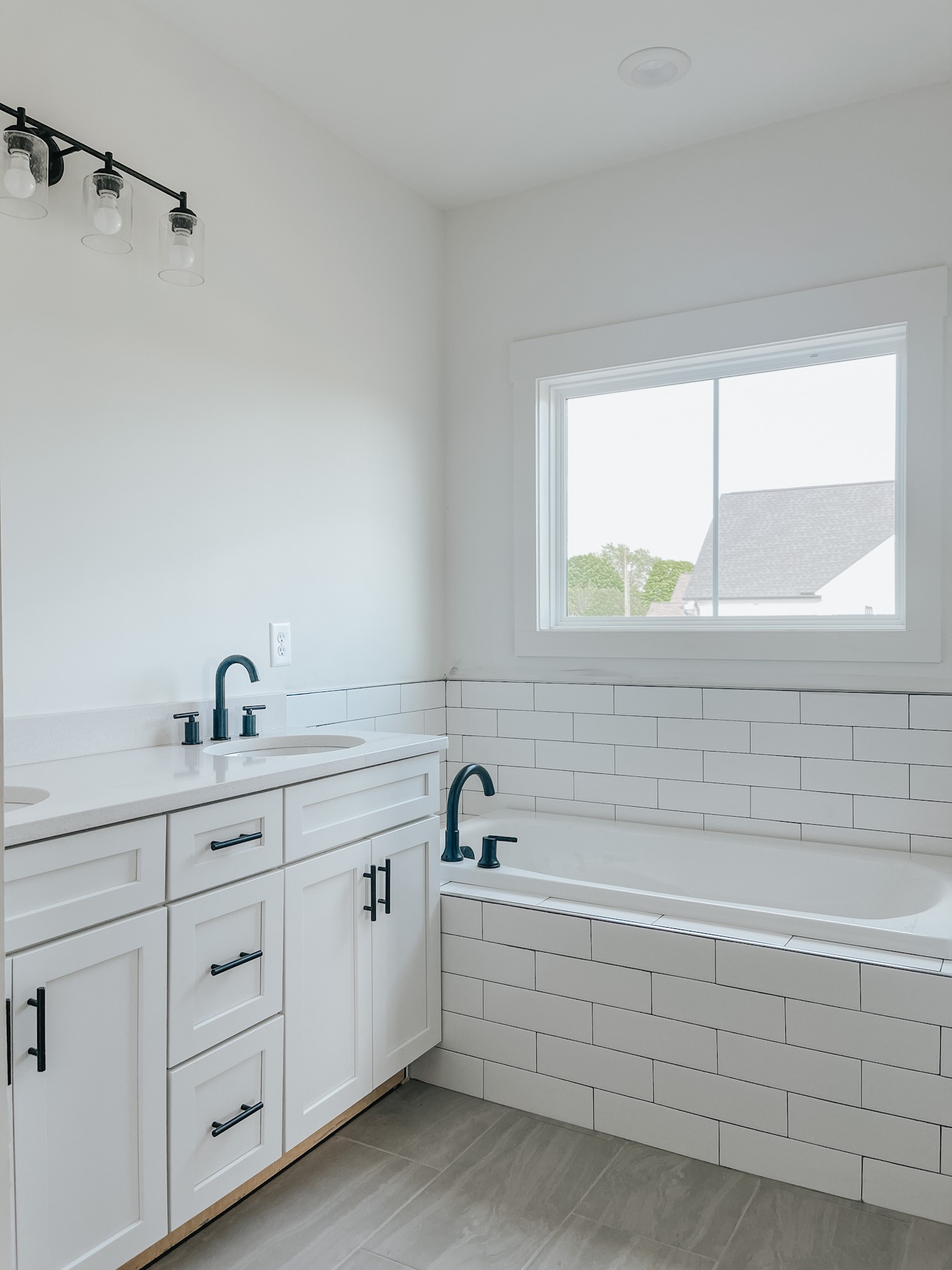 1402 Fowler Ford Road Portland, TN 37148 - Photo 21 of 27 a bathroom with a bathtub and a window