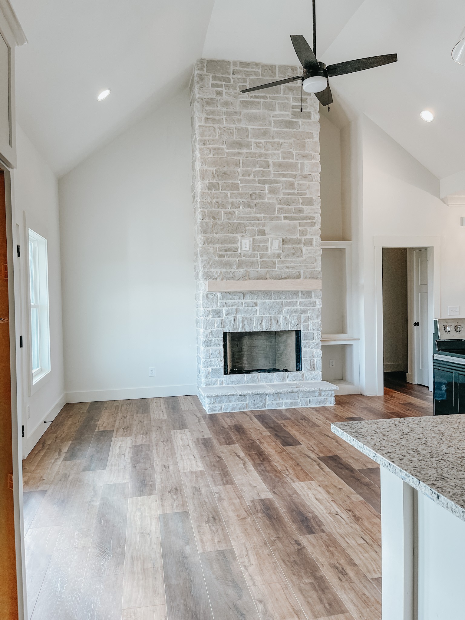 1402 Fowler Ford Road Portland, TN 37148 - Photo 6 of 27 a view of empty room with a fireplace and fan