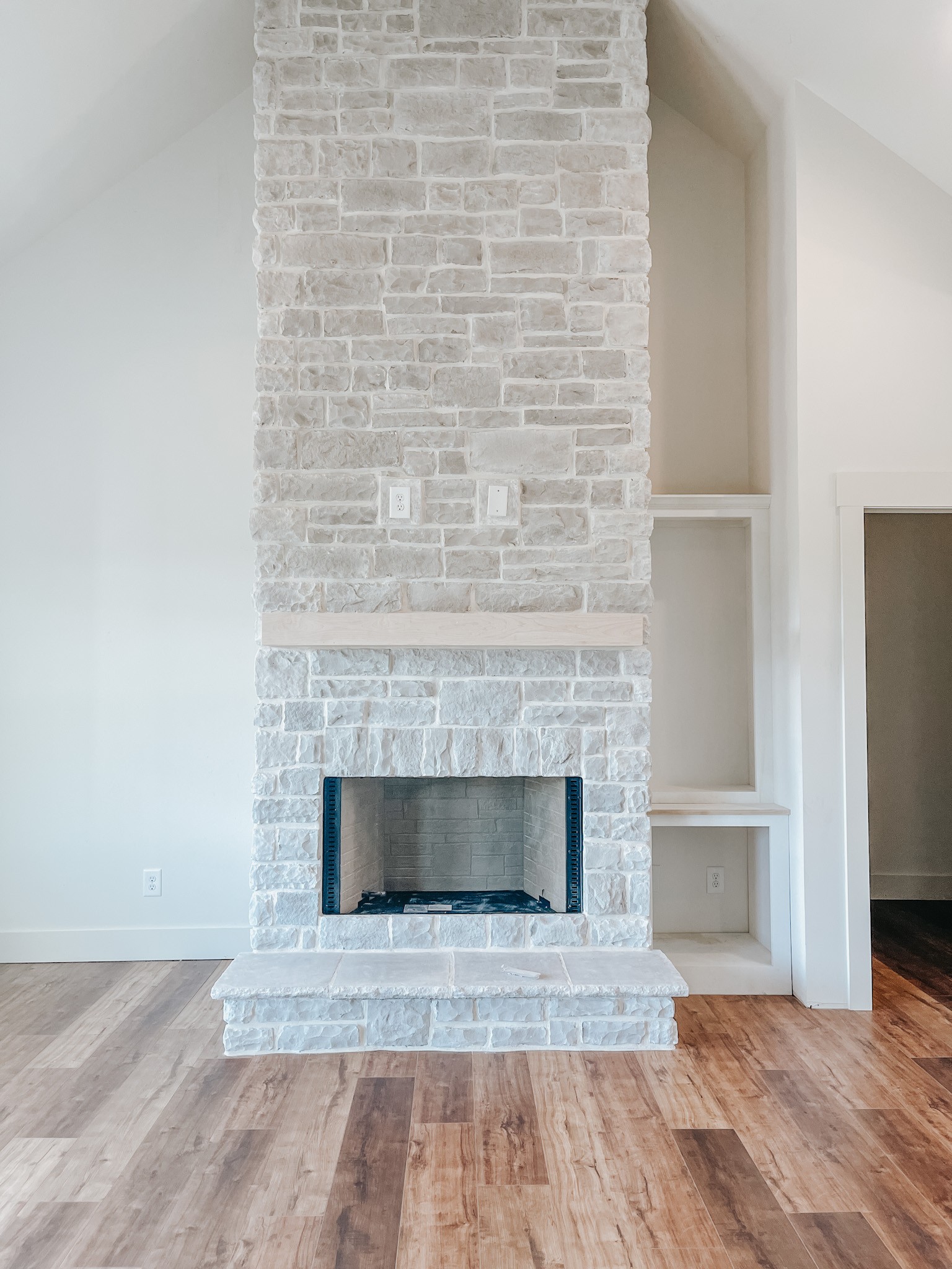 1402 Fowler Ford Road Portland, TN 37148 - Photo 8 of 27 a hallway with fireplace and wooden floor