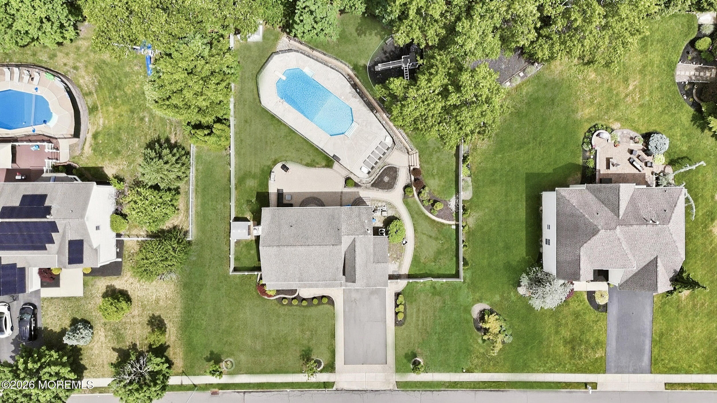 2055 MacKenzie Road Toms River, NJ 08755 - Photo 50 of 56 an aerial view of a house with a garden and trees