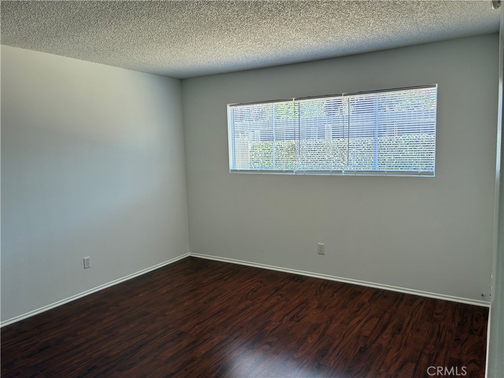 517 Queenanne Road Paso Robles, CA 93446 - Photo 9 of 18 Good sized master bedroom has a big window to let the morning sun in through the new blinds and look out into the back yard. Beautiful flooring, a big wardrobe closet with extra shelving.