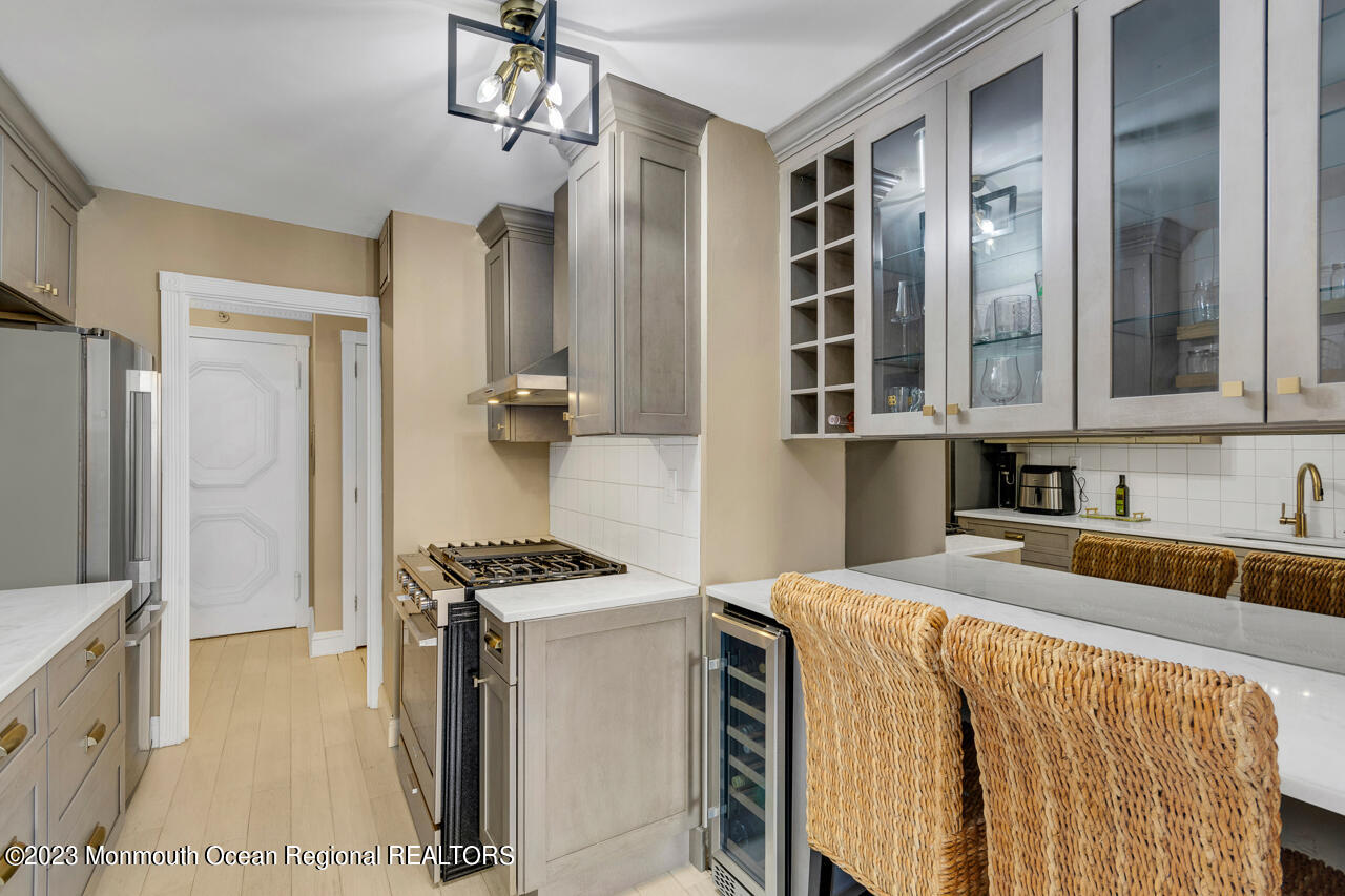 28 Riverside Avenue, Unit 4J Red Bank, NJ 07701 - Photo 3 of 18 a kitchen that has a cabinets and a stove