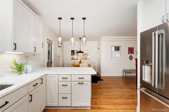 a kitchen with stainless steel appliances a refrigerator stove and microwave