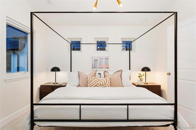 a bedroom with a bed and a cabinets