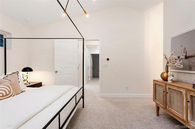 a bathroom with a granite countertop sink a mirror and a shower