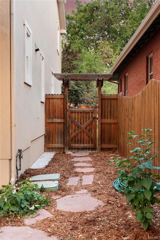 a front view of a house with a yard and swimming pool