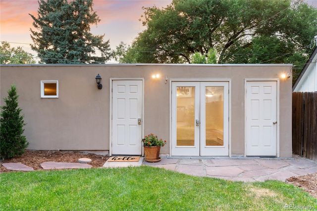 an aerial view of a house with a yard and lake view