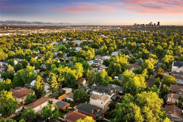 a picture of a bench in front of a wall