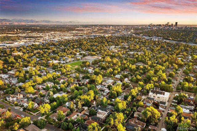 a picture of a park with an bench