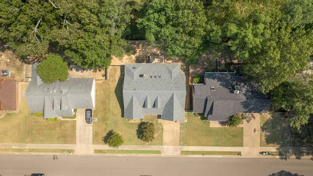 an aerial view of residential house with outdoor space and parking