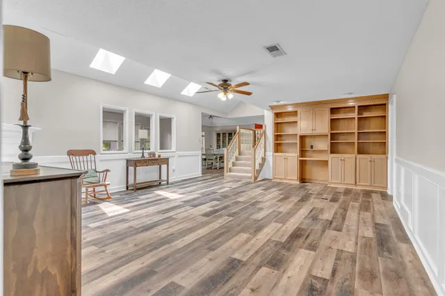 a view of a kitchen with a sink and cabinets