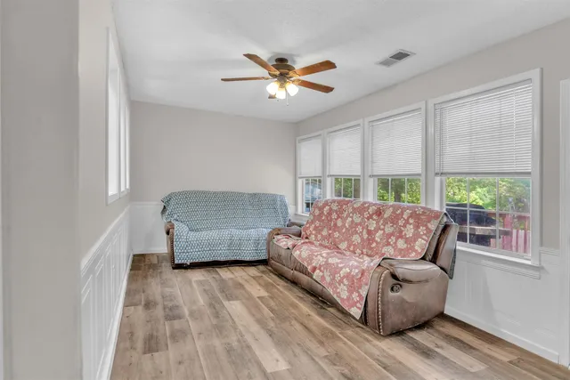a living room with a couch and a window
