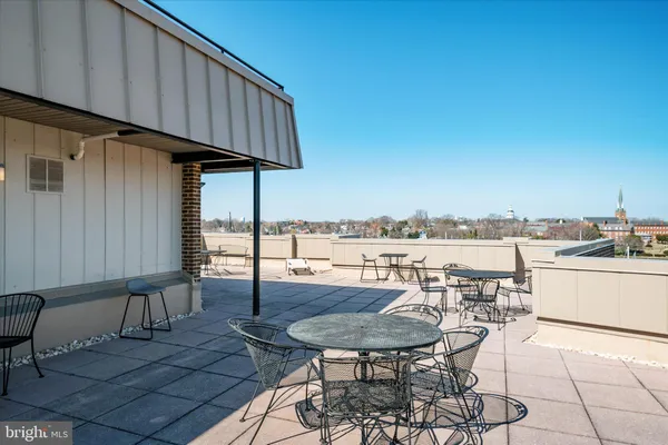 a view of a terrace with furniture and stove