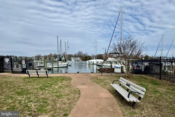 a swimming pool with outdoor seating and yard