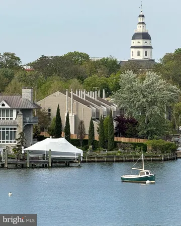 a front view of a house with a garden and parking space