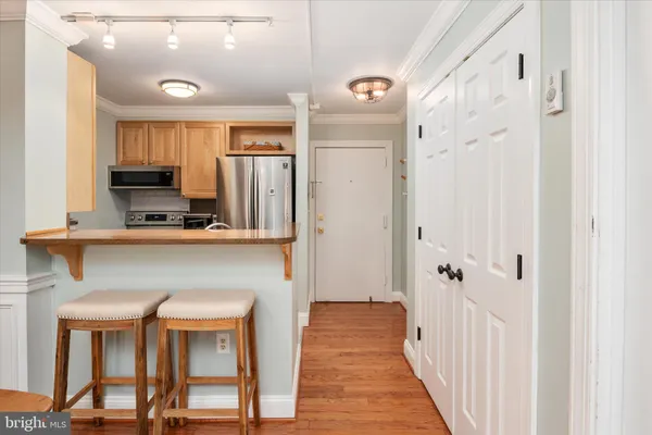 a view of a kitchen with furniture and a window