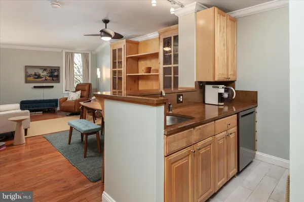 a kitchen that has a sink and a stove in it