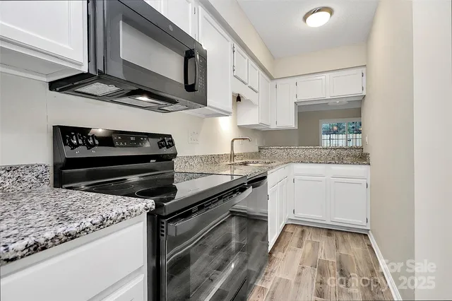 a kitchen with a stove and a microwave