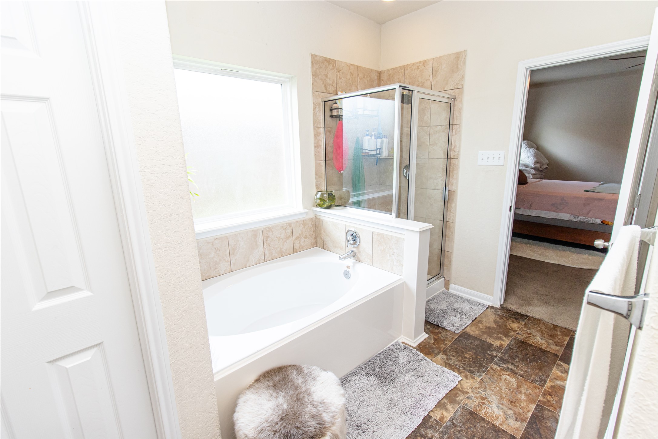 8222 Pastel Dawn Trace Houston, TX 77049 - Photo 13 of 35 a en suite bathroom with a tub shower and sink