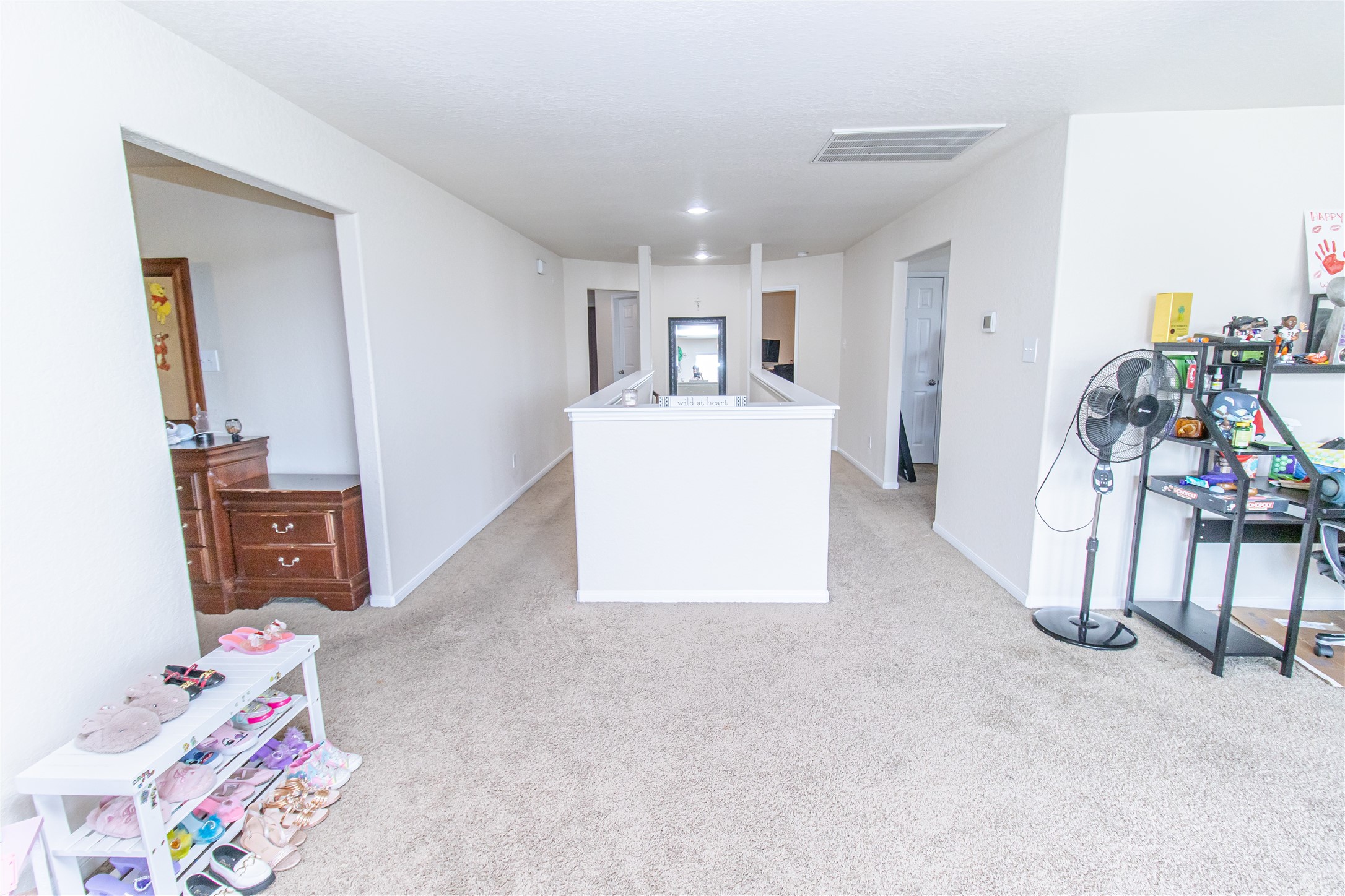 8222 Pastel Dawn Trace Houston, TX 77049 - Photo 14 of 35 a living room with furniture and a table