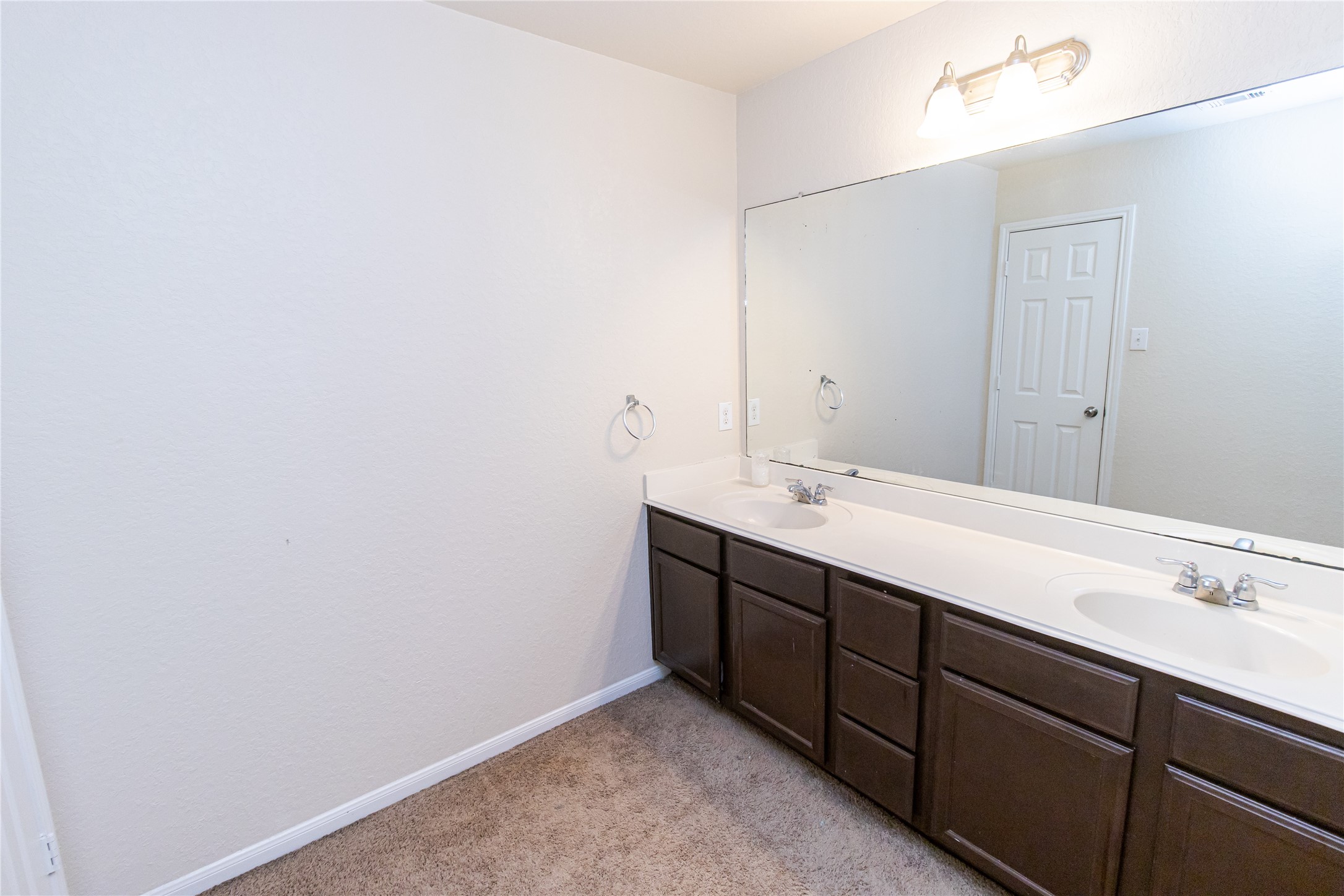 8222 Pastel Dawn Trace Houston, TX 77049 - Photo 16 of 35 a bathroom with a sink and a mirror
