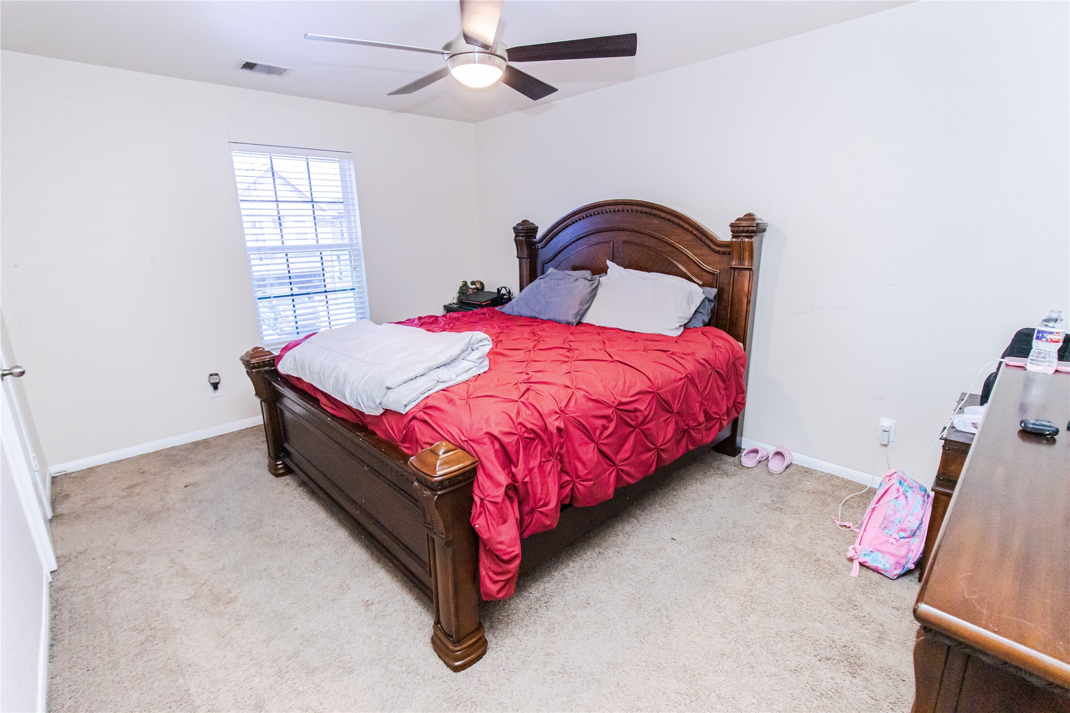 8222 Pastel Dawn Trace Houston, TX 77049 - Photo 20 of 35 a bedroom with a bed and window