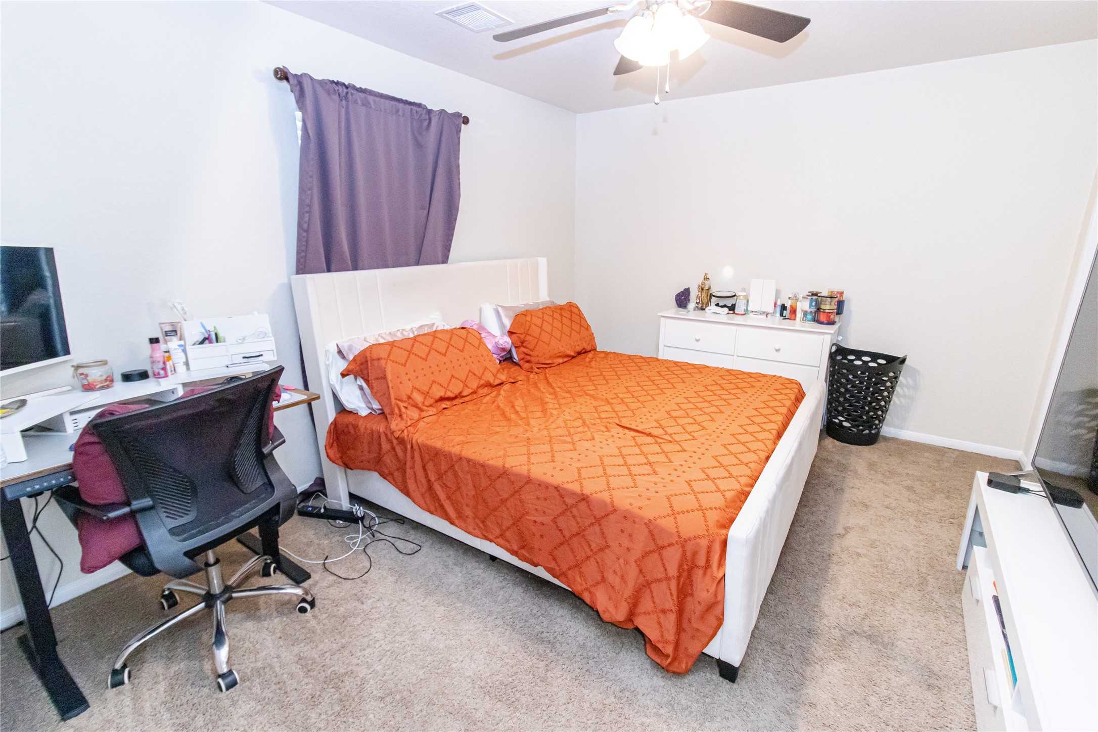 8222 Pastel Dawn Trace Houston, TX 77049 - Photo 21 of 35 a bedroom with a bed and a chair in it