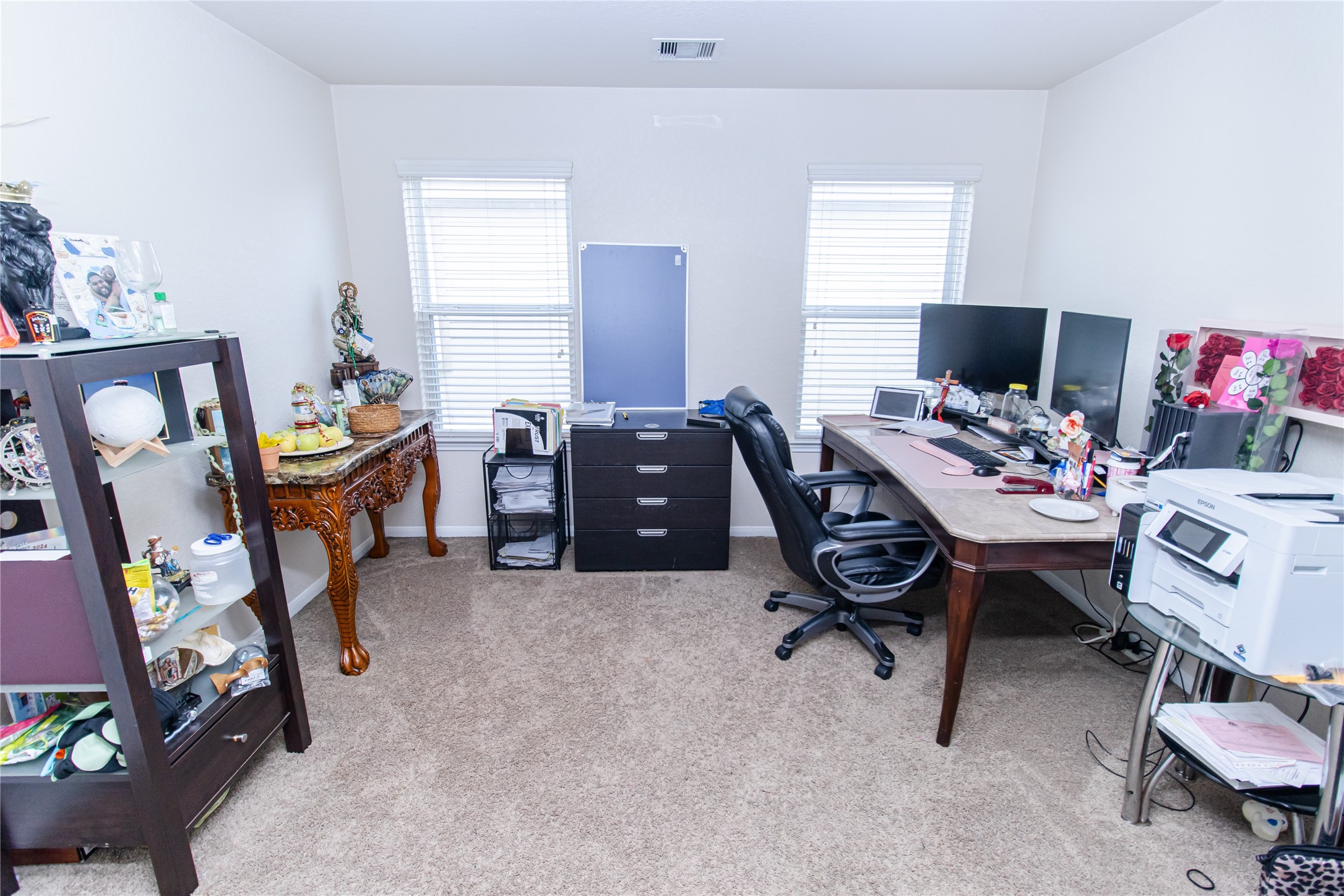 8222 Pastel Dawn Trace Houston, TX 77049 - Photo 26 of 35 a view of a workspace with furniture and a window
