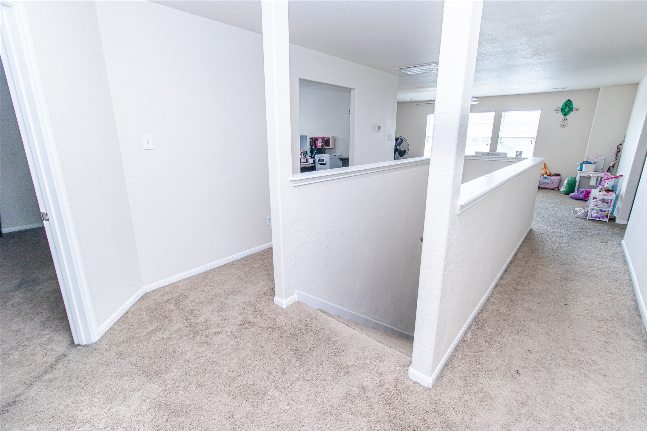 8222 Pastel Dawn Trace Houston, TX 77049 - Photo 28 of 35 a view of a hallway to a livingroom and a hallway