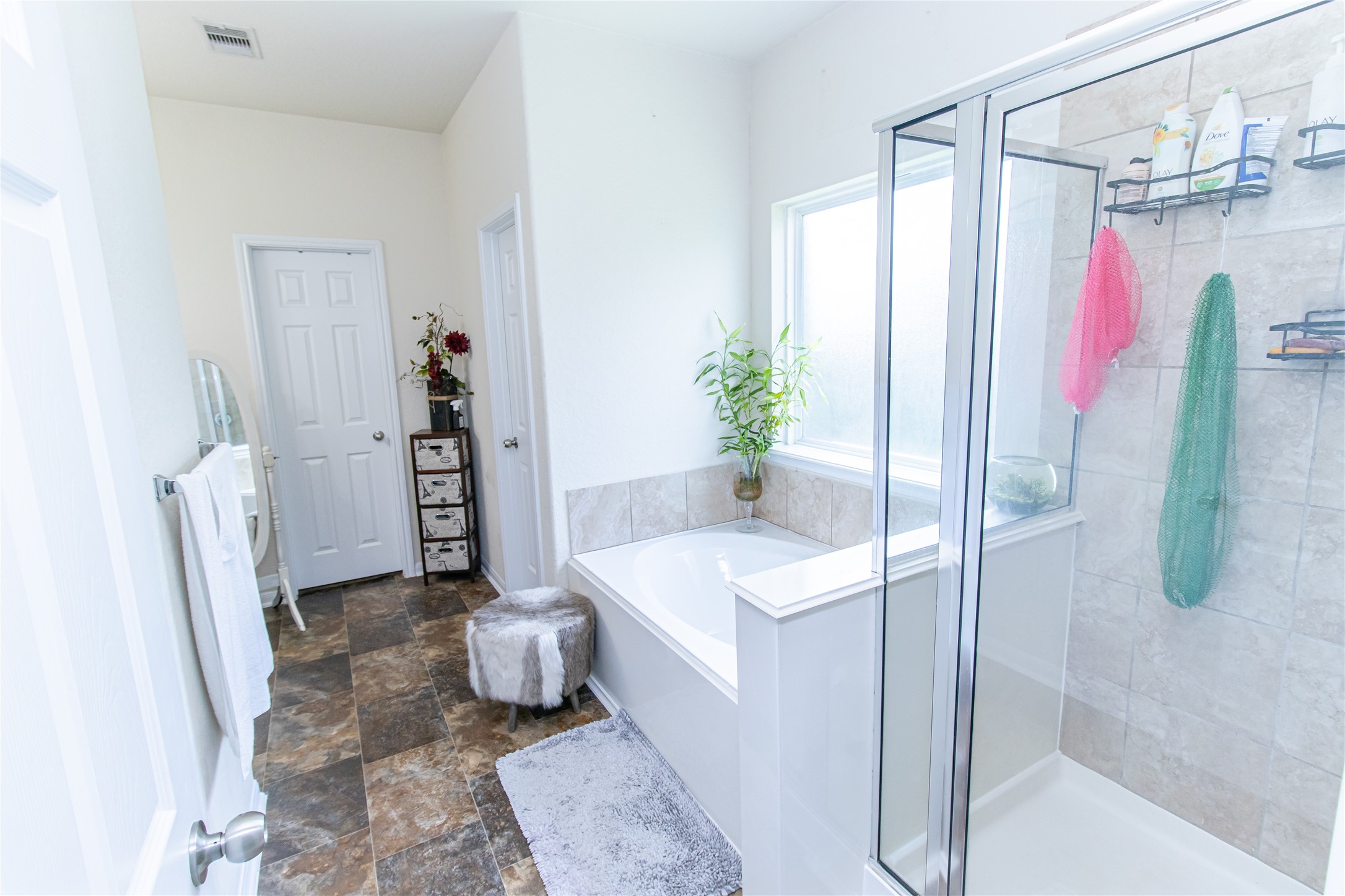 8222 Pastel Dawn Trace Houston, TX 77049 - Photo 33 of 35 a bathroom with a tub and shower
