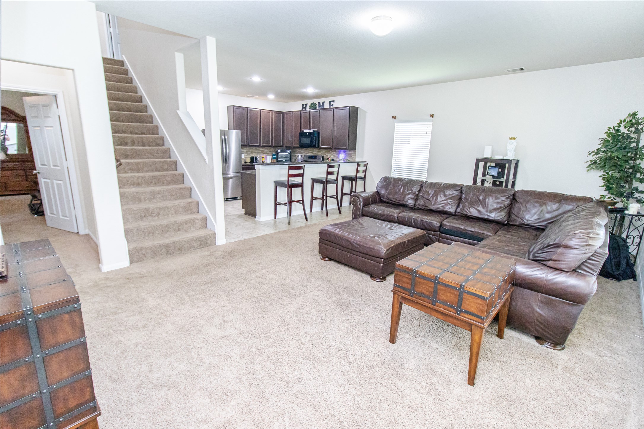 8222 Pastel Dawn Trace Houston, TX 77049 - Photo 6 of 35 a living room with furniture and a wooden floor