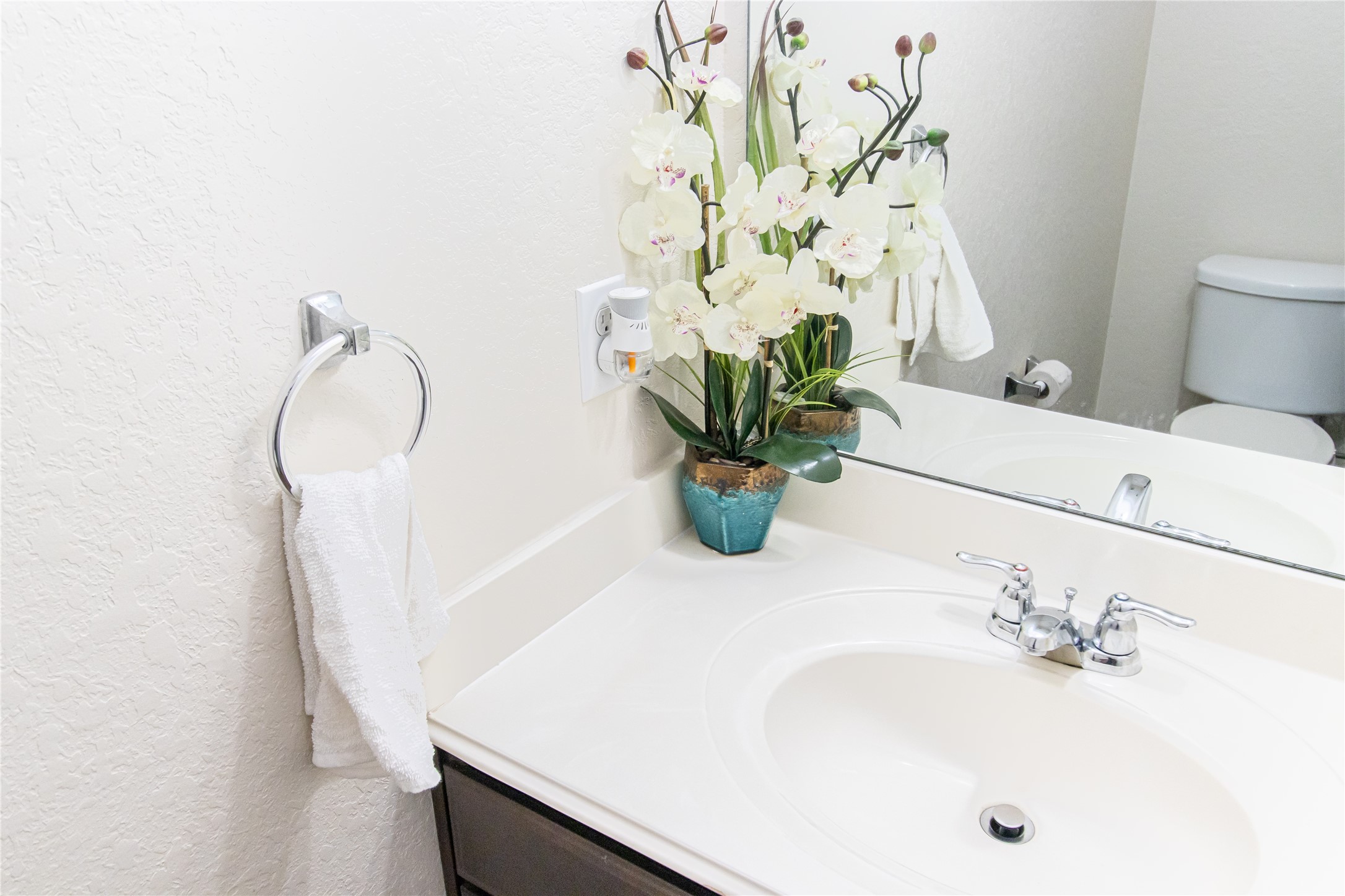 8222 Pastel Dawn Trace Houston, TX 77049 - Photo 10 of 35 a bathroom with a sink a toilet and a mirror