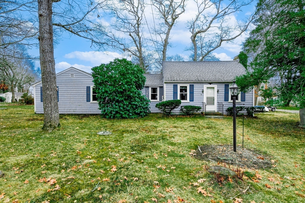 10 Converse Road Marion, MA 02738 - Photo 1 of 33 a front view of a house with garden