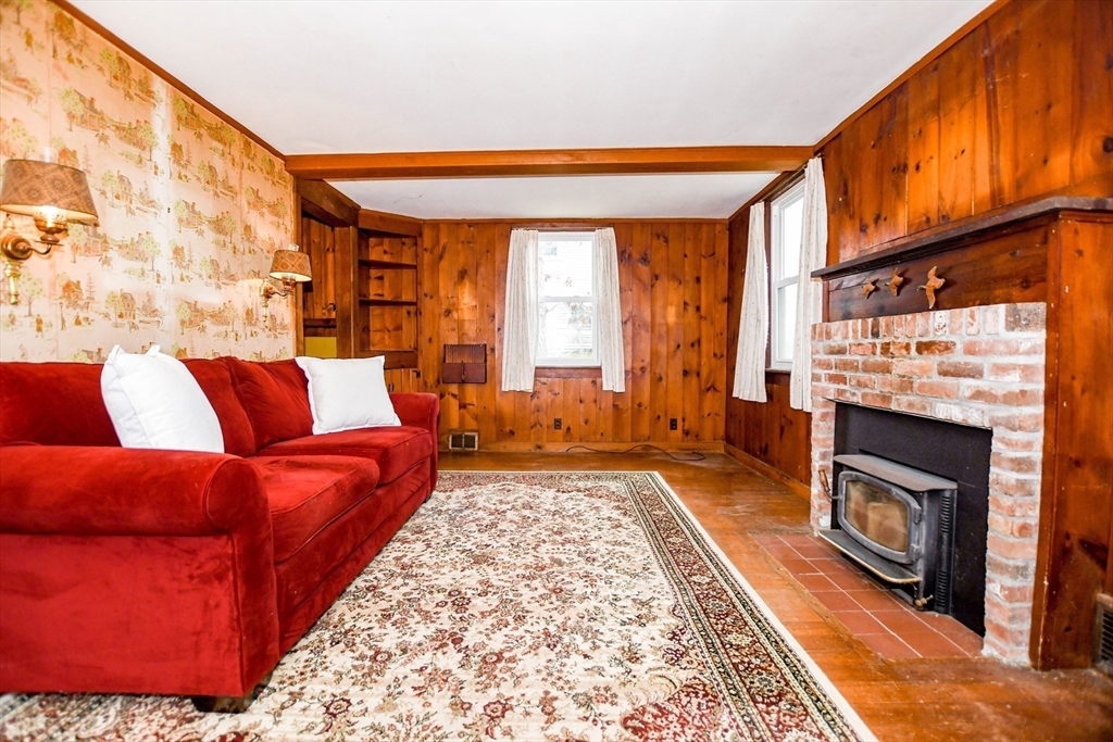 10 Converse Road Marion, MA 02738 - Photo 12 of 33 a living room with a couch and a fireplace