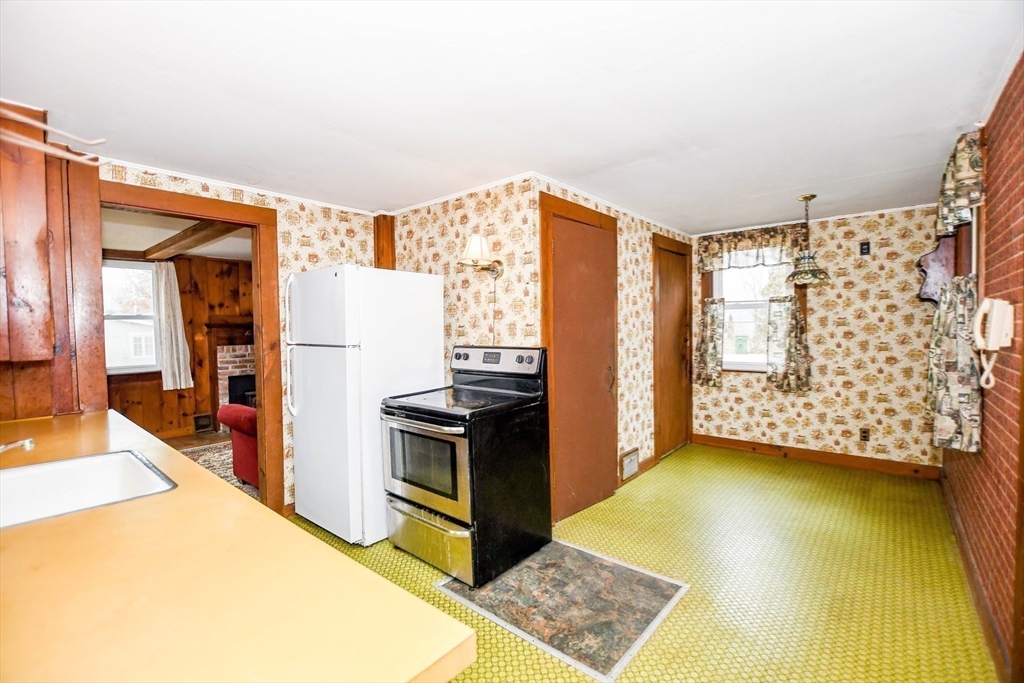 10 Converse Road Marion, MA 02738 - Photo 14 of 33 a view of a kitchen with fridge and workspace