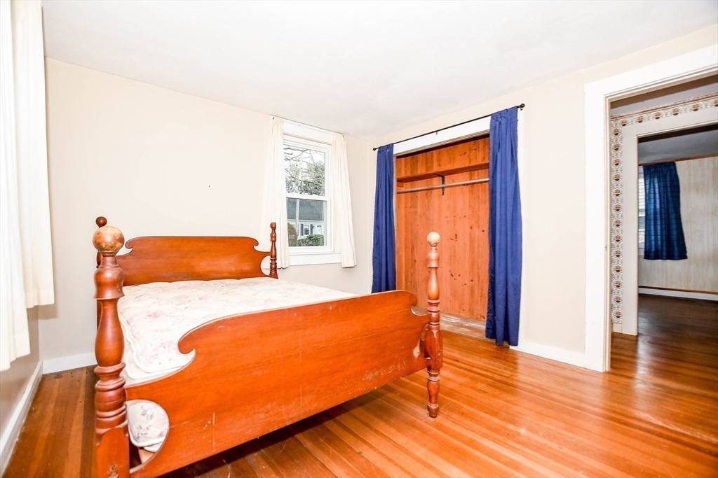 10 Converse Road Marion, MA 02738 - Photo 22 of 33 a bedroom with a bed and wooden floor