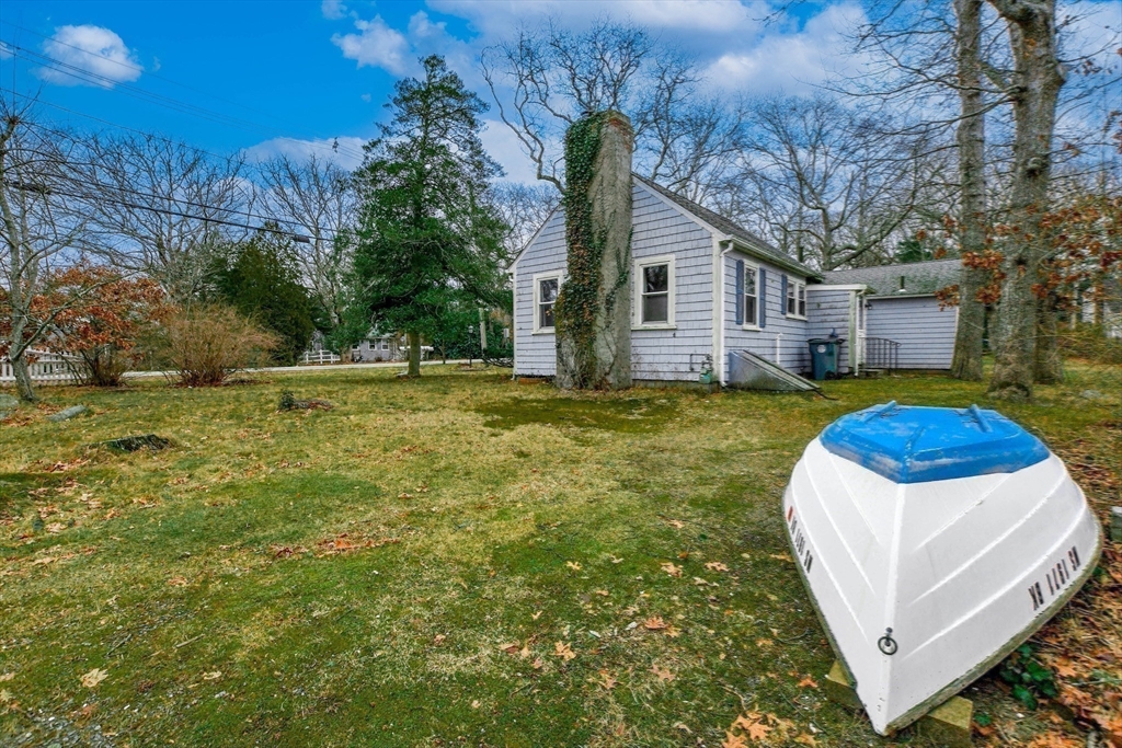 10 Converse Road Marion, MA 02738 - Photo 30 of 33 a view of a house with backyard and trees
