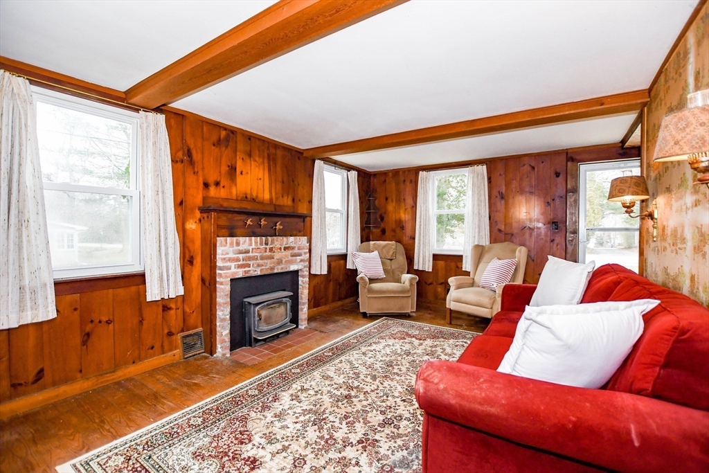 10 Converse Road Marion, MA 02738 - Photo 8 of 33 a living room with furniture a fireplace and a window