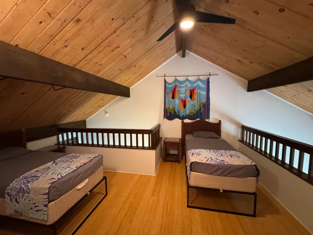 a bedroom with furniture and a wooden floor